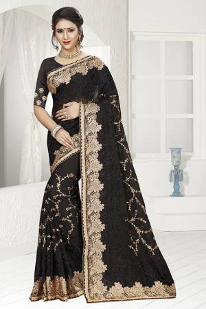 For A Bold And Beautiful Look, Grab This Designer Heavy Saree In Black Color .This Saree Is Georgette Based Beautified With Heavy Embroidery Work Paired With Art Silk Fabricated Blouse. Buy This Saree Now.