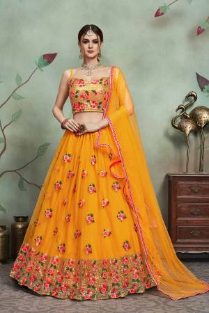 Get Ready For The Upcoming Festive And Wedding Season With This Heavy Designer Lehenga Choli In All Over Musturd Yellow Color. Its Blouse, Lehenga And Dupatta Are Fabricated On Soft Net Beautified With Contrasting Thread Work Giving It An Attractive Look. 