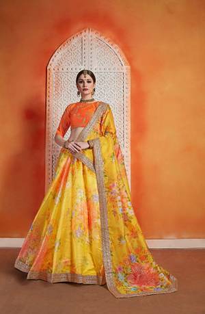 Shine Bright Wearing This Very Beautiful And Trendy Patterned Designer Lehenga Choli In Orange Colored Blouse Paired With Contrasting Yellow Colored Lehenga and Dupatta. Its Blouse Is Fabricated On Art Silk Paired With Orgenza Fabricated Lehenga And Dupatta. 