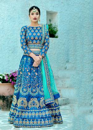 Go With Shades Of Blue Wearing This Heavy Designer Lehenga Choli In Blue Color Paired With Turquoise Blue Colored Dupatta. This Lehenga Choli Is Fabricated On Art Silk Paired With Net Fabricated Dupatta. Buy Now.