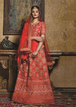 Bright And Visually Appealing Color Is Here With This Heavy Designer Lehenga Choli In All Over Red Color. Its Blouse And Lehenga Are Fabricated on Art Silk Paired With A Net Fabricated Dupatta And A Silk Based Shawl. The Shawl Look With The Lehenga Is Very Trending Nowadays. Buy Now.