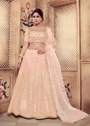 New And Pretty Shade Is Here To Add Into Your Wardrobe With This Heavy Designer Lehenga Choli In Pastel Peach Color. Its Embroiderd blouse Is Fabricated On Orgenza Paired With Georgette Fabricated Lehenga And Dupatta. Buy This Pretty Piece Now.