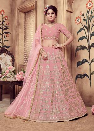 Look Pretty Wearing This Very Beautified Designer Lehenga Choli In All Over Pink Color .This Lehenga Choli IS Fabricated On Art Silk Paired With Net Fabricated Dupatta. It Has Attractive Foil Print And Hand Work Which Will Definitelt Earn You Lots Of Compliments From Onlookers. 