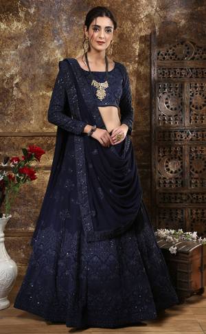 Enhance Your Personality Wearing This Heavy Designer Lehenga Choli In All Over Navy Blue Fabricated Georgette. Its Lehenga Choli And Dupatta Are Beautified With Tone To Tone Thread Embroidery And Sequence Work. Also It Is Light Weight And Comfortable To Carry Throughout The Gala. 