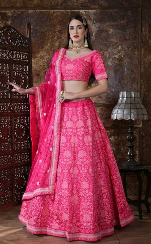 Catch All The Limelight At The Next Wedding You Attend Wearing This Heavy Designer Lehenga Choli In Dark Pink Color. Its Blouse And Lehenga Are Fabricated On Art Silk Paired With Net Fabricated Dupatta. It Is Beautified With Pretty Tone To Tone Thread And Coding Work. Buy Now.