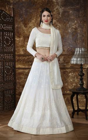 Enhance Your Personality Wearing This Heavy Designer Lehenga Choli In All Over Off-White Fabricated Georgette. Its Lehenga Choli And Dupatta Are Beautified With Tone To Tone Thread Embroidery And Sequence Work. Also It Is Light Weight And Comfortable To Carry Throughout The Gala. 