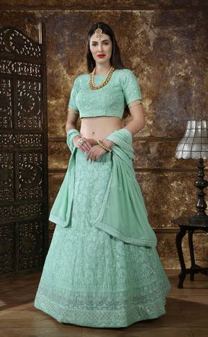 Enhance Your Personality Wearing This Heavy Designer Lehenga Choli In All Over Pastel Green Fabricated Georgette. Its Lehenga Choli And Dupatta Are Beautified With Tone To Tone Thread Embroidery And Sequence Work. Also It Is Light Weight And Comfortable To Carry Throughout The Gala. 