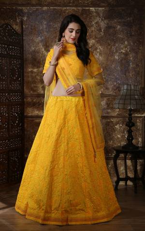 Catch All The Limelight At The Next Wedding You Attend Wearing This Heavy Designer Lehenga Choli In Musturd Yellow Color. Its Blouse And Lehenga Are Fabricated On Art Silk Paired With Net Fabricated Dupatta. It Is Beautified With Pretty Tone To Tone Thread And Coding Work. Buy Now.