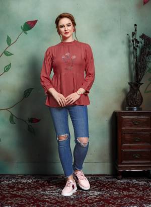 Grab This Pretty Designer Readymade Top In Maroon Color Fabricated On Rayon. It Has Elegant High Neck Pattern Beautified With Thread Work. 