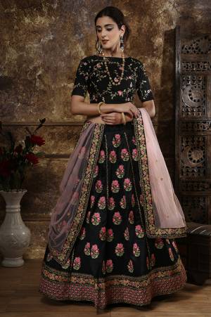 Get Ready For This Wedding Season And Be The Most Sensational Diva Wearing This Bold and Stylish Heavy Designer Lehenga Choli In Black Color Paired With Baby Pink Colored Dupatta. This Heavy Embroidered Lehenga Choli Is Fabricated On Art Silk Paired With Net Fabricated Dupatta. It Is Beautified With Contrasting Embroidery Over The Blouse And Lehenga. 