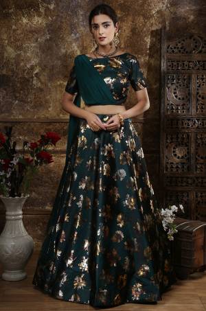 New Shade Is Here Add Into Your Wardrobe With This Designer Lehenga Choli In Teal Green Color Paired With Teal Green Colored Attached Dupatta. This Lehenga And Choli Are Fabricated On Satin Silk Paired With Georgette Fabricated Dupatta. This Attractive Looking Blouse And Lehenga Are BEautified With Foil Prints All Over.