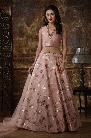 Look Pretty In This Very Beautiful And Trendy Shade With This Designer Lehenga Choli In Dusty Pink Color. This Lehenga Choli Is Fabricated On Art Silk Beautified With Attractive Foil Print Paired With net Fabricated Dupatta. 