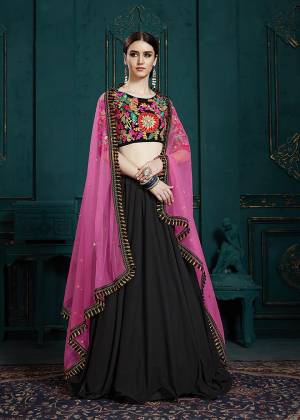 Go Colorful With This Designer Lehenga Choli In Multi Colored Blouse Paired With Black Colored Lehenga And Dark Pink Colored Dupatta. Its Blouse And Lehenga Are Fabricated On Georgette Paired With Net Fabricated Dupatta. 