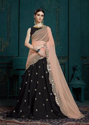 You Will Definitely Earn Lots Of Compliments Wearing This Designer Lehenga Choli In Black Color Paired With Peach Colored Dupatta. It Is Beautified With Attractive Mirror Work And Cutwork Dupatta. Its Lovely Color Pallete And Embroidery Give You A Look Like Never Before. 