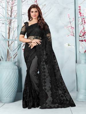 Here Is A Very Beautiful And Heavy Designer Saree In Black Color. This Beautiful Heavy Embroidered Saree And Blouse Are Fabricated On Net Beautified With Pretty Tone To Tone Resham Embroidery And Ceramic Stone Work. Buy This Heavy Yet Subtle Looking Saree Now.