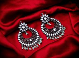 Grab These Beautiful Pair Of Earrings In Silver Color Beautified With Stone And Pearl Work. You Can Pair This Up With Any Kind Of Kurti, Suit Or Lehenga. Buy Now.