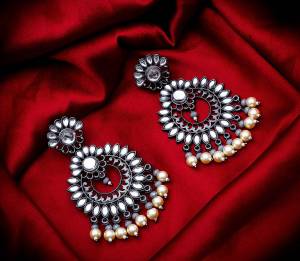 Grab These Beautiful Pair Of Earrings In Silver Color Beautified With Stone And Pearl Work. You Can Pair This Up With Any Kind Of Kurti, Suit Or Lehenga. Buy Now.