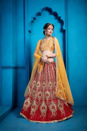 Go Colorful With This Very Beautiful Heavy Designer Lehenga Choli In Golden Colored Blouse Paired With Red Colored Lehenga And Musturd Yellow Colored Dupatta. This Lehenga Choli Is Silk Based Paired With Net Fabricated Dupatta. 