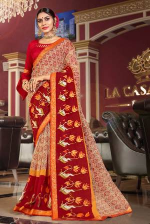 Here Is A Pretty Saree For Your Semi-Casual Wear. This Beautiful Printed Saree Is Fabricated On Super Net Paired With Art Silk Fabricated Blouse. Its Attractive Broad Border Is Beautified With Multi Colored Thread Work. 