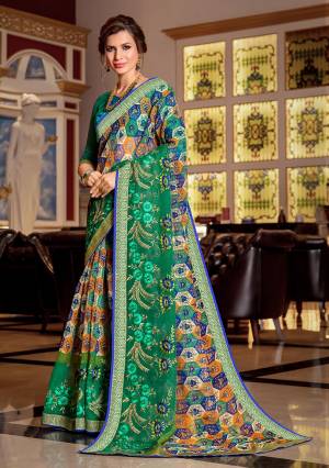 Here Is A Pretty Saree For Your Semi-Casual Wear. This Beautiful Printed Saree Is Fabricated On Super Net Paired With Art Silk Fabricated Blouse. Its Attractive Broad Border Is Beautified With Multi Colored Thread Work. 