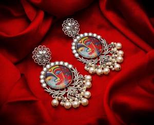 Grab This Beautiful And Attractive Pair Of Elegant Earrings Set In Silver Color. This Pretty Pair Is Beautified With Stone Work And Can Be Paired With Any Colored Traditional Attire. Buy Now.