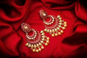 Grab This Pretty Attractive Looking Earrings Set In Golden Color?Highlighted With Red Color Beautified With Stone Work. This Earrings Set Is Light Weight And Can Be Paired With Same Or Any Contrasting Colored Traditional Attire.