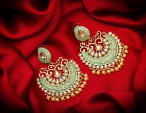 Grab This Pretty Attractive Looking Earrings Set In Golden Color?Highlighted With Pastel Green Color Beautified With Stone Work. This Earrings Set Is Light Weight And Can Be Paired With Same Or Any Contrasting Colored Traditional Attire.