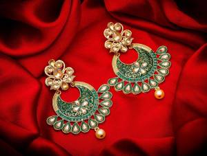 Grab This Pretty Attractive Looking Earrings Set In Golden Color?Highlighted With Teal Green Color Beautified With Stone Work. This Earrings Set Is Light Weight And Can Be Paired With Same Or Any Contrasting Colored Traditional Attire.