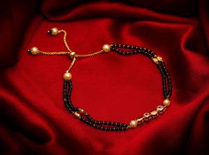 Here Is Very Pretty And Trending Mangalsutra Bracelet In Black And?Gold. This Mangalsutra Bracelet Has A Pretty Delicate Design And Pattern Which Gives An Elegant Look To Your Wrist. Buy This Latest Trend Now.?