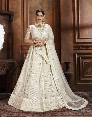 Flaunt Your Rich And Elegant Taste Wearing This Heavy Designer Lehenga Choli In White Color. This Beautifully Embroidered Heavy Lehenga Choli And Its Dupatta Are Fabricated On Net. Its Elegant Color And Detailed Embroidery Will Earn You Lots Of Compliments From Onlookers. 