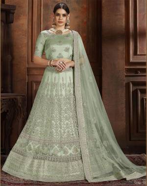 Get Ready For The Upcoming Wedding Season With This Very Beautiful Heavy Designer Lehenga Choli In Pastel Green Color. Its Heavy Embroidered Blouse, Lehenga And Choli Are Fabricated On Net Which Is Light In Weight And Easy To Carry Throughout The Gala. 