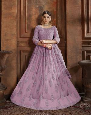 Flaunt Your Rich And Elegant Taste Wearing This Heavy Designer Lehenga Choli In Lilac Color. This Beautifully Embroidered Heavy Lehenga Choli And Its Dupatta Are Fabricated On Net. Its Elegant Color And Detailed Embroidery Will Earn You Lots Of Compliments From Onlookers. 