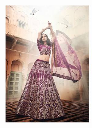 You Will Definitely Earn Lots Of Compliments Wearing This Heavy Designer Lehenga Choli In All over Dark Purple Color. This Heavy Embroidered Lehenga Choli Is Silk based Paired With Net Fabricated Dupatta. Buy Now.