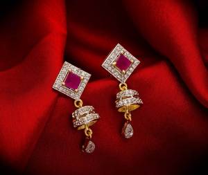 Here Is A Very Pretty Pair Of Simple And Elegant Looking Earring?Set In Golden Color. It Has Pretty Unique pattern With Attractive Diamond Work. You can Pair This Even With Simple Attire As Well As A Heavy One. This Pretty Evergreen Design Compliments Any Kind Of Attire You Wear.