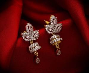 Here Is A Very Pretty Pair Of Simple And Elegant Looking Earring?Set In Golden Color. It Has Pretty Unique pattern With Attractive Diamond Work. You can Pair This Even With Simple Attire As Well As A Heavy One. This Pretty Evergreen Design Compliments Any Kind Of Attire You Wear.