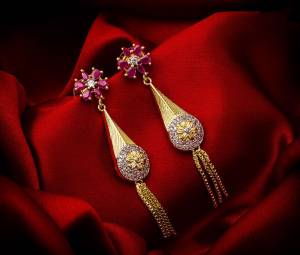 Here Is A Very Pretty Pair Of Simple And Elegant Looking Earring Set In Golden Color. It Has Pretty Unique pattern With Attractive Diamond Work. You can Pair This Even With Simple Attire As Well As A Heavy One. This Pretty Evergreen Design Compliments Any Kind Of Attire You Wear.?