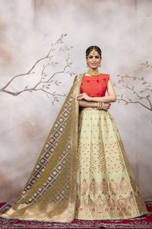 Go Colorful with Thid Very Designer Lehenga Choli In Orange Colored Blouse Paired With Pastel Green Colored Lehenga And Grey Colored Dupatta. This Lehenga Choli And Dupatta Are Silk Based Beautified With Weave. Buy Now.