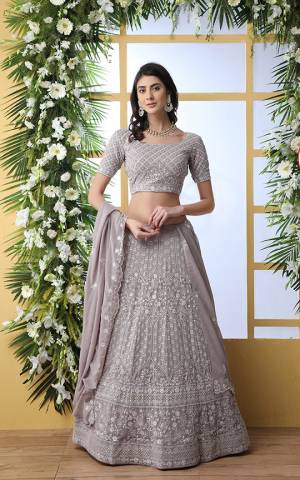 Flaunt Your Rich And Elegant Taste Wearing This Heavy Designer Lehenga Choli In Light Grey Color. This Pretty Tone To Tone Embroidered Lehenga Choli Is Georgette Based. It Has Lovely Tone To Tone Embroidery With Sequence Work Giving A Heavy Yet Subtle Look. Buy Now.