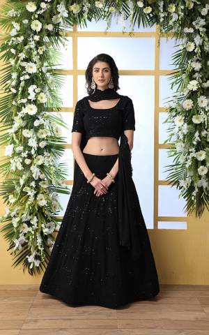 Here Is A Bold And Beautiful Heavy Designer Lehenga Choli In Black Color. Its Blouse, Lehenga And Dupatta Are Fabricated On Georgette Beautified With Tone To Tone Resham Embroidery And Sequence Work. 