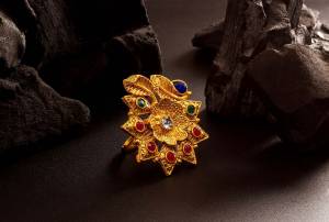 Here Is Royal Looking Designer Finger Ring In Golden Color Beautified With Stone Work. The Rich Golden Color And Pattern Will Give An Elegant Look To Your Hand, Buy Now.