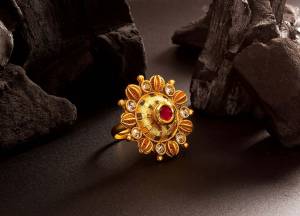 Here Is Royal Looking Designer Finger Ring In Golden Color Beautified With Stone Work. The Rich Golden Color And Pattern Will Give An Elegant Look To Your Hand, Buy Now.