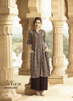 Here Is A Rich Looking Designer Readymade Printed Kurti In Grey And Multi Color. This Pretty Kurti Is Fabricated On Rayon And You Can Pair This Up With Leggings, Pants Or Plazzo. 