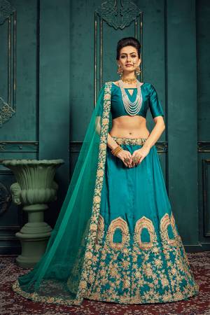 Add This Pretty Designer Lehenga Choli To Your Wardrobe In Pretty Blue Color. It Blouse And Lehenga are Fabricated On Tafeta Art Silk Paired With Net Fabricated Dupatta. It Is Beautified With Detailed Embroidery Over Panel. 