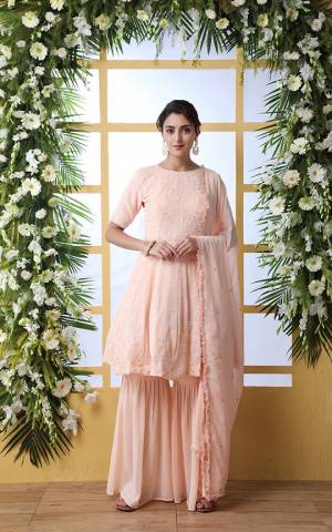 Here Is A Very Pretty Designer Sharara Suit In Light Peach Color. Its Pretty Top and Bottom Are Georgette Based Paired With Chiffon Fabricated Dupatta. It Is Beautified With Tone To Tone Embroidery Giving An Elegant Look.