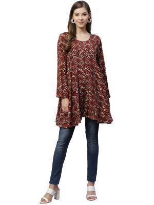 Be It Your College, Home Or Work Place This Readymade Top Is Suitable For All. This Lovely Brown Colored Top Is Rayon Based, Its Rich Color And Fabric Will Earn You Lots Of Compliments From Onlookers.