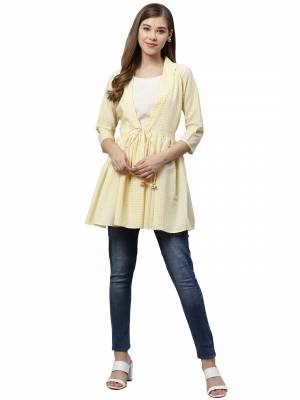 Be It Your College, Home Or Work Place This Readymade Top Is Suitable For All. This Lovely White & Yellow Colored Top Is Muslin Based, Its Rich Color And Fabric Will Earn You Lots Of Compliments From Onlookers.