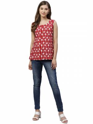 Grab This Pretty Readymade Top In Red Color Fabricated On Muslin. Pair This Up With Black Or Blue Colored Denim. Buy This Top Now.