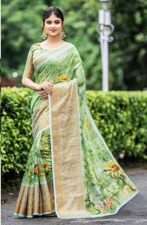 Simple And Elegant Looking Designer Saree Is Here In Light Green Color Paired With Light Green Colored Blouse. This Saree And Blouse Are Fabricated On Cotton Beautified With Print And Weave. Buy This Saree Now.