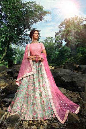 Look Pretty In This Lovely Pink And Light Green Colored Designer Lehenga Choli. This Pretty Heavy Embroidered Lehenga Choli Is Net Based Which Is Light Weight And Easy To Carry Throughout The Gala.