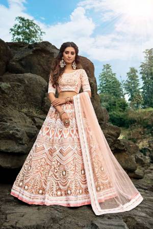 Simple And Elegant Looking Yet Heavy Lehenga Choli Is Here In Peach Color. This Designer Heavy Embroidered Lehenga Choli IS Fabricated On Net Beautified With Thread Embroidery. 